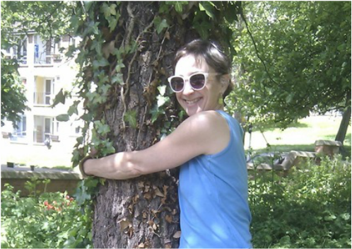 A woman hugging a tree